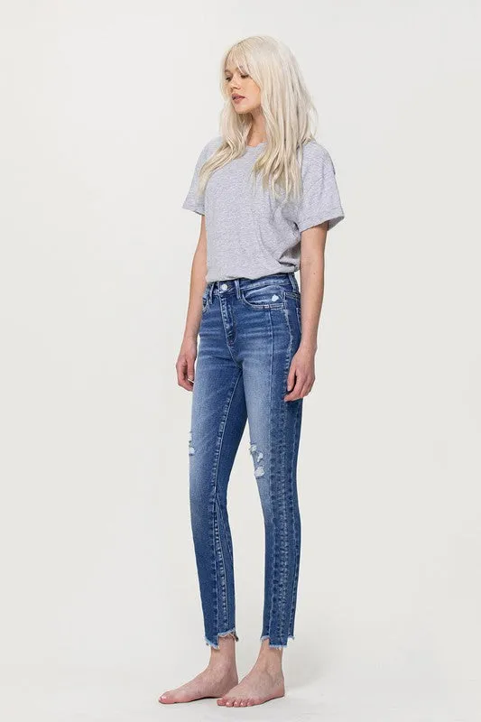 HIGH RISE ANKLE SKINNY W UNEVEN HEM DETAIL